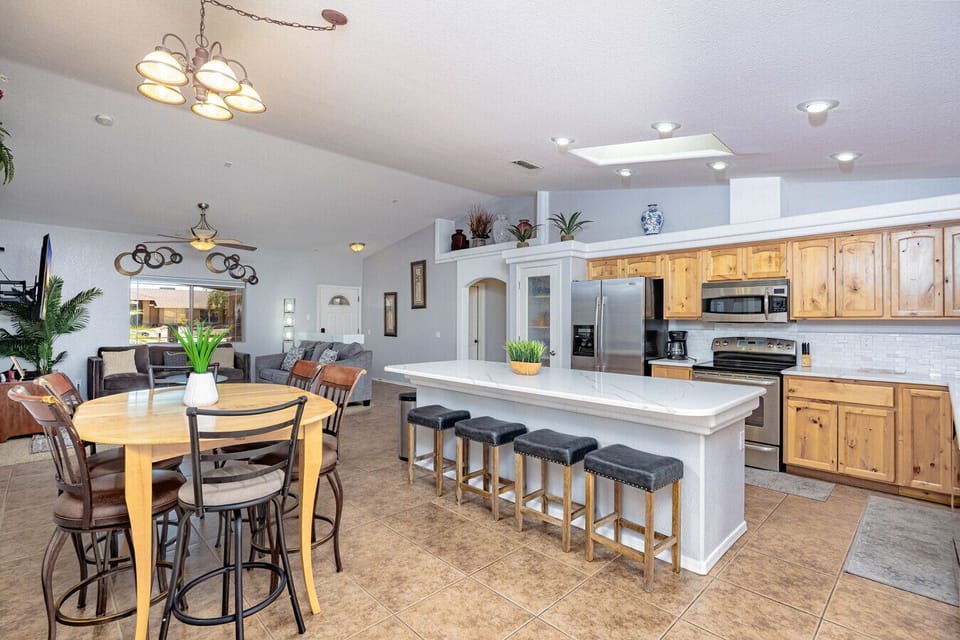 Spacious kitchen with island seating and a cozy dining area