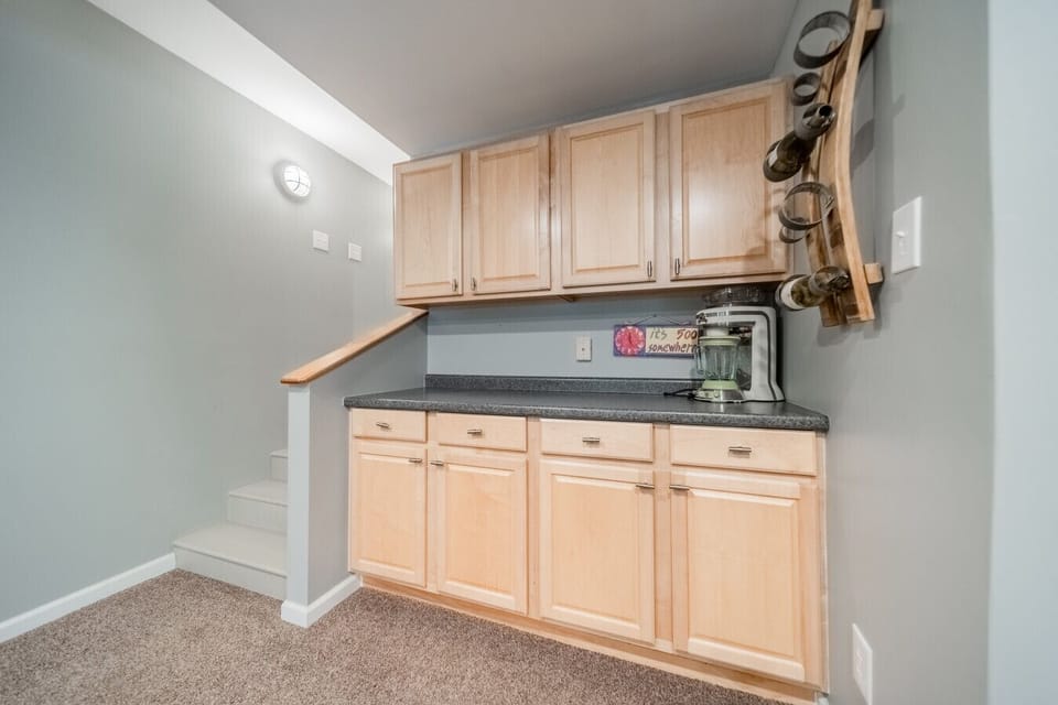 The downstairs living area also has a counter for making drinks and storage as needed.