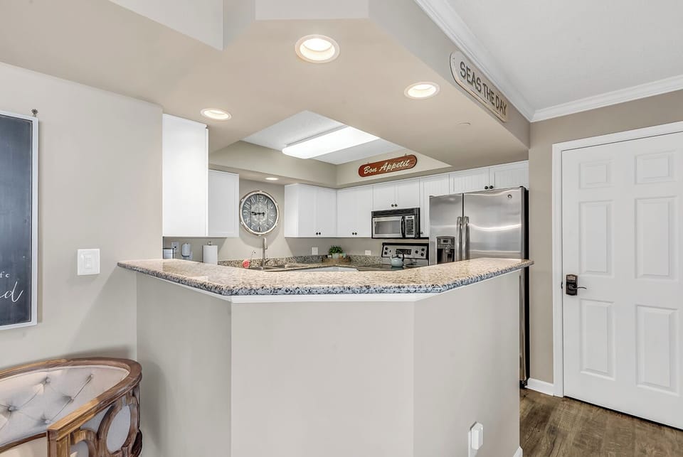 The kitchen is fully stocked with all the essentials, making it perfect for preparing and enjoying meals together