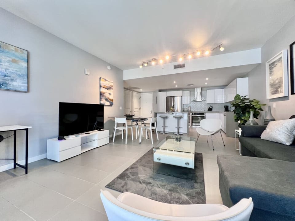 Sleek, modern living space with open-plan kitchen and dining area.