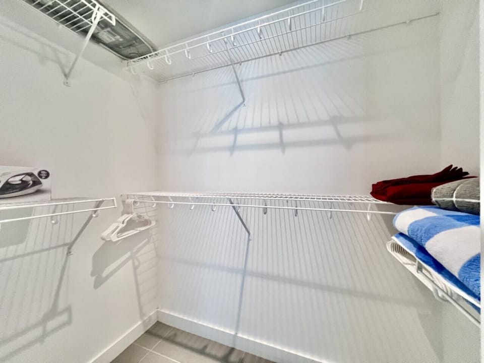Spacious walk-in closet with ample storage.