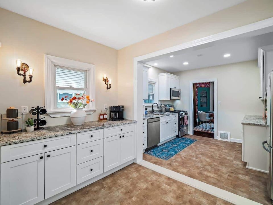 Clean modern kitchen w/ sleek cabinetry & an open, airy layout