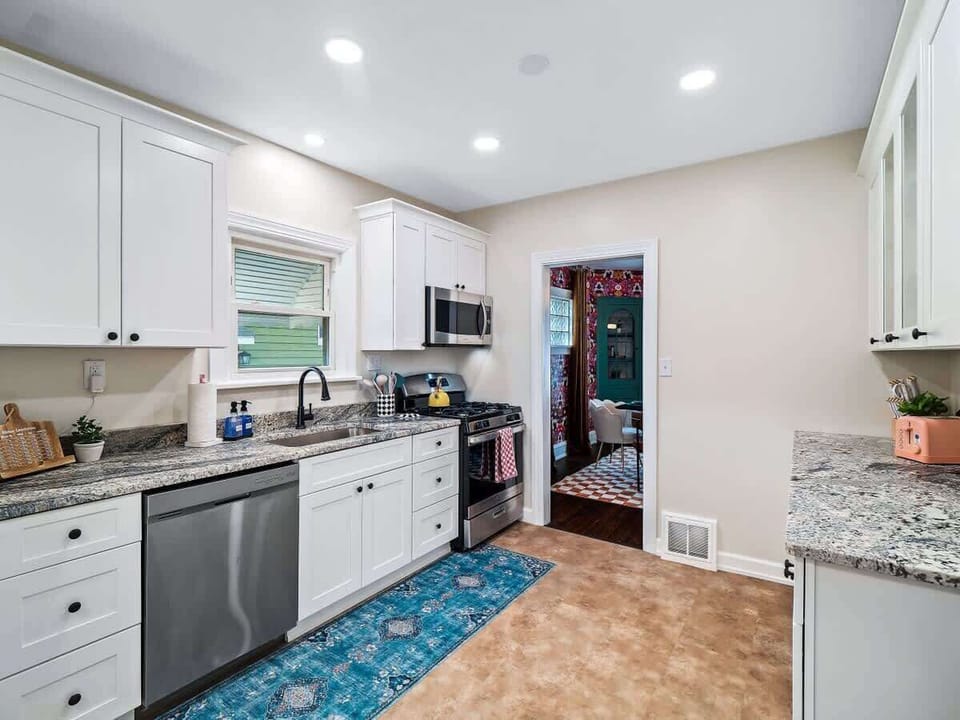Bright kitchen w/ sleek counters, stainless appliances & plenty of space to cook together