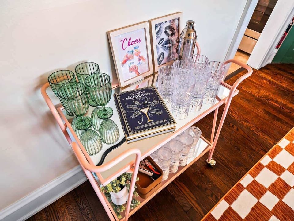 Cheerful dining nook w/ patterned floor & a cozy table for drinks or games