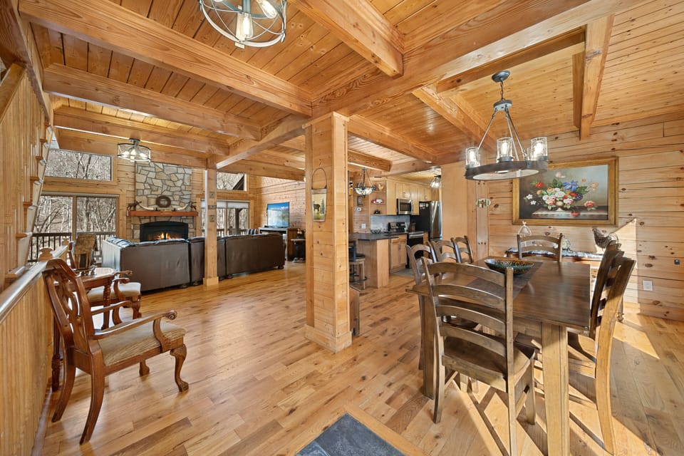Open Floor Plan with Floor to Ceiling Wood and Exposed Beams