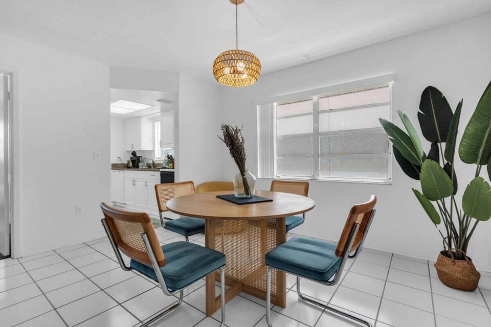 Bright dining nook with seating for four and natural light all day