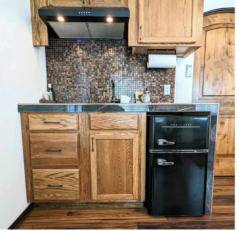 Suite 2 Kitchenette has an induction cooktop, microwave, toaster oven, and more.