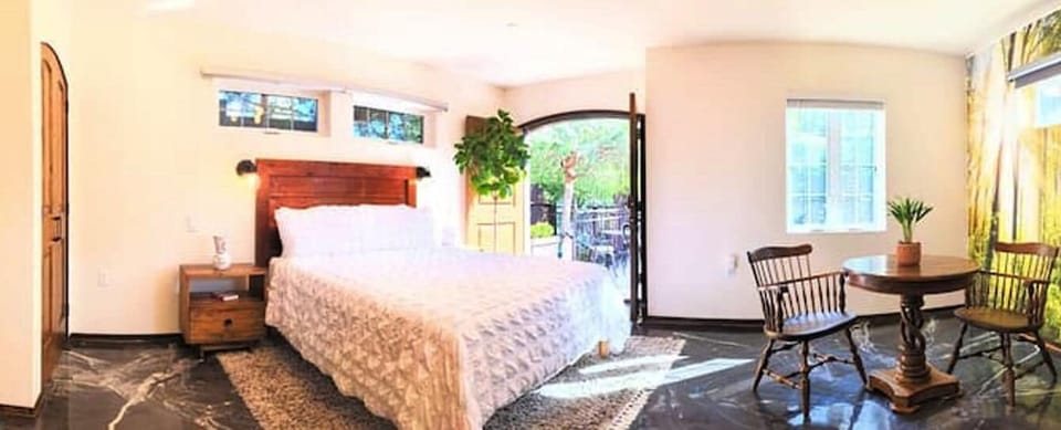 Suite 1 - Distinctive with a queen bed, kitchenette & courtyard fountain views.