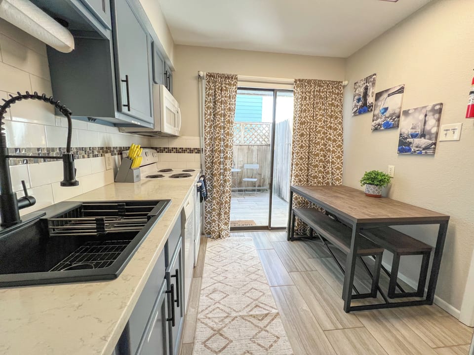 Fully equipped kitchen with modern appliances, cookware, and ample space—perfect for preparing delicious meals during your stay!🍽️✨