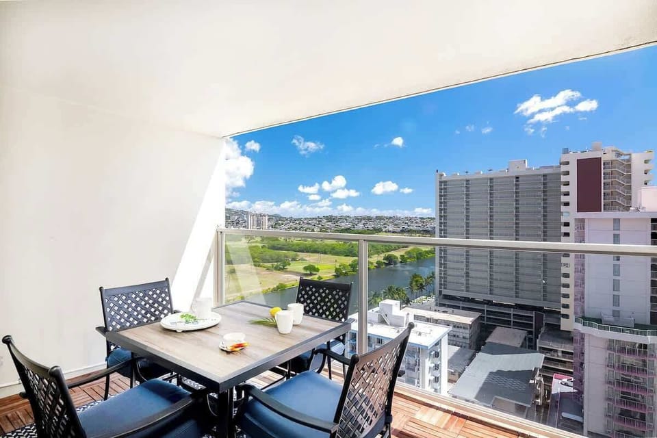 Savor your morning coffee with a view from the private balcony, offering stunning views of the city and Ala Wai Canal.