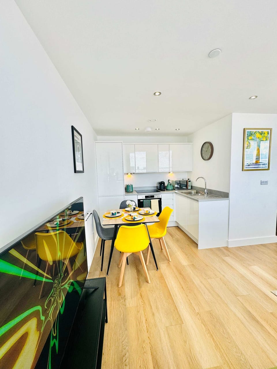 Light-filled hallway leading into the open-plan kitchen and dining area with a welcoming, modern feel throughout