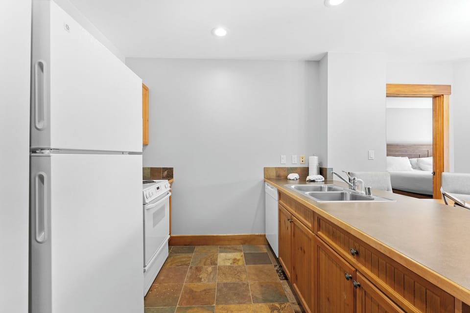 Private kitchen with all the essential appliances to make a home-cooked meal.