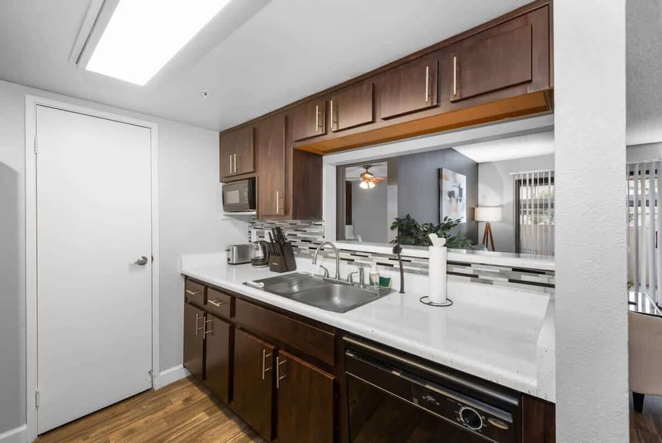 Functional kitchen with oven, stove, fridge and basic cooking ware