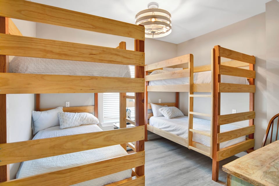 1st floor guest bedroom with 2 sets of twin bunks, sleeps 4