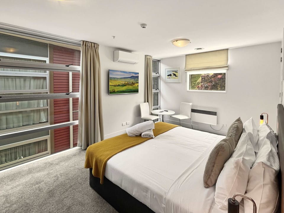 Bedroom view with dining nook and TV