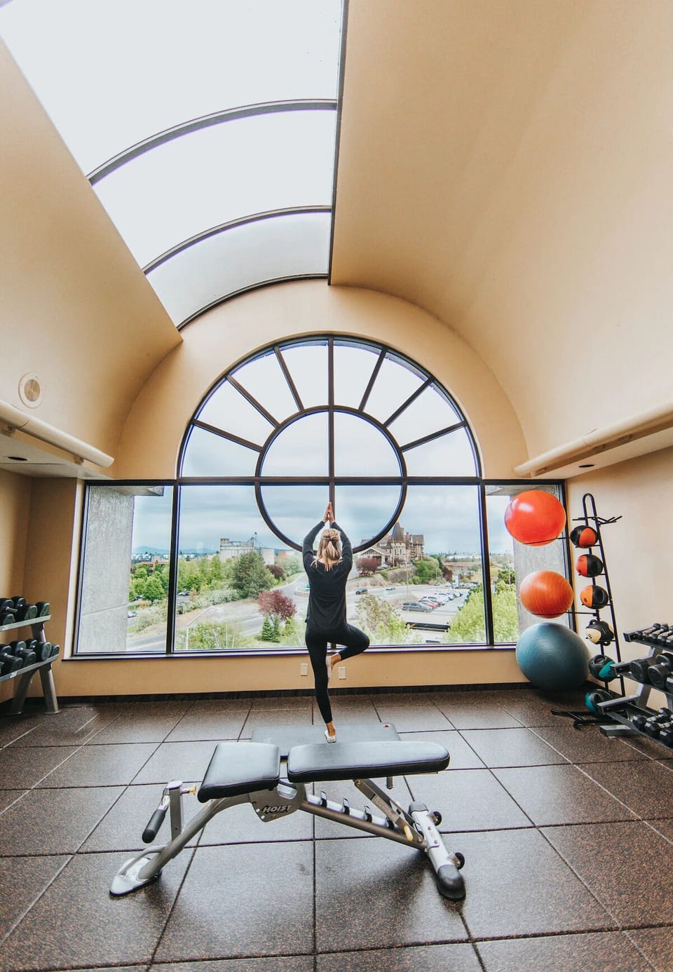 Energize your morning with skyline workouts in a bright gym.