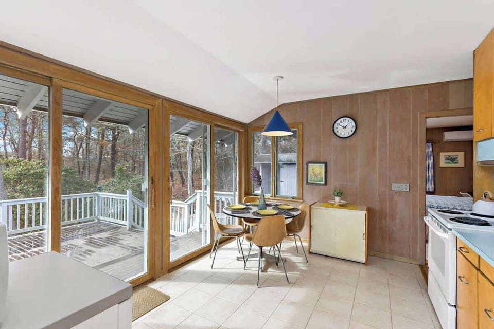 A view from the living room looking into the kitchen and over the spacious side deck