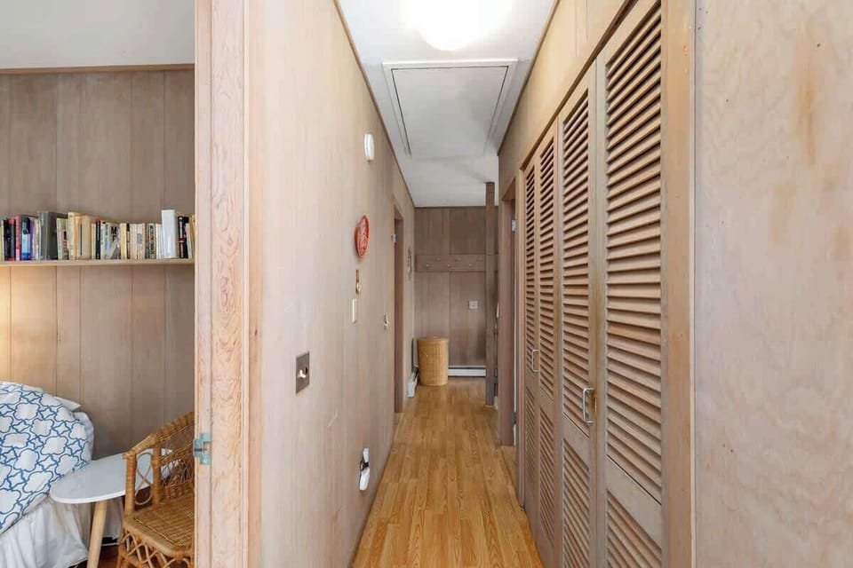 A washer and dryer are tucked away in the hall closet