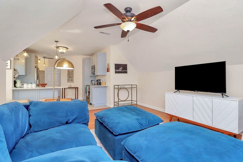 Large living room with the comfiest couch and a smart TV