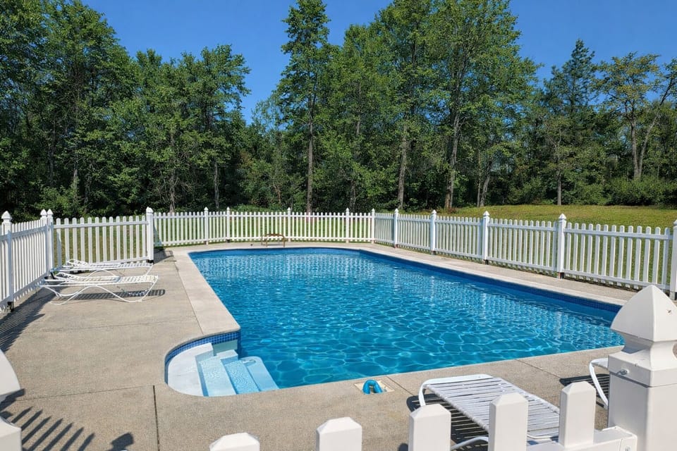 Enjoy the privacy of a full-size in-ground luxury pool in our 7 acres of yard!