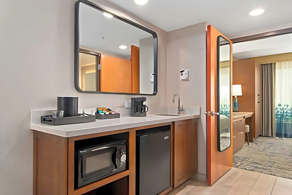 Grab snacks and morning coffee with an easy in-room kitchenette.