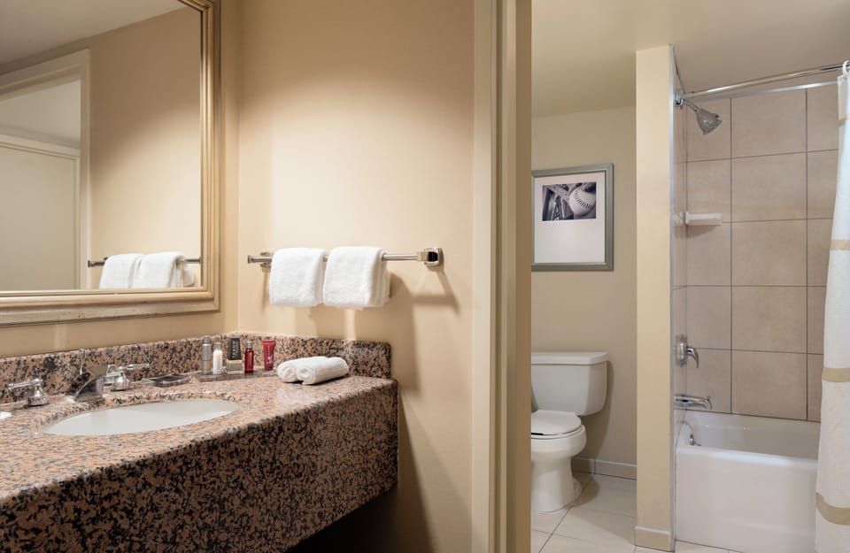 Refresh at the spacious granite vanity with bright mirror lighting.