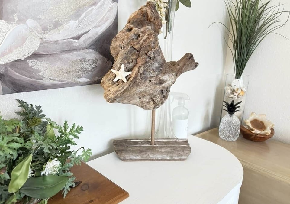 Driftwood art in the dining room at white magnolia galveston