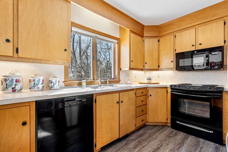 A fully equipped kitchen with timeless charm and all cooking necessities.