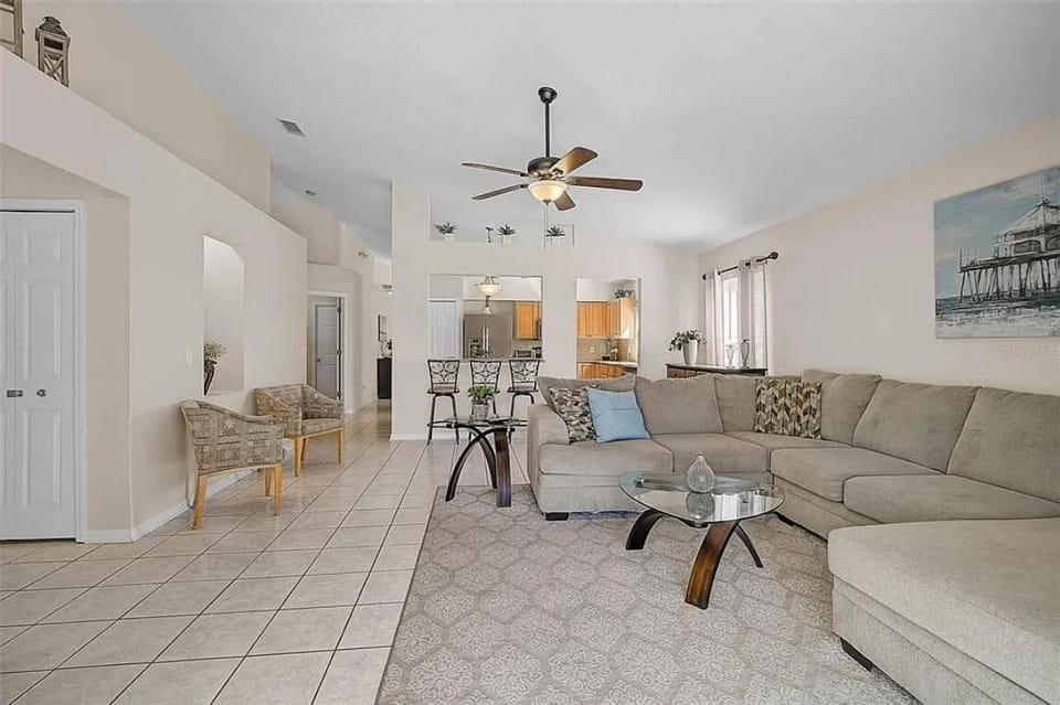 Spacious living room with cozy sectional and open dining area