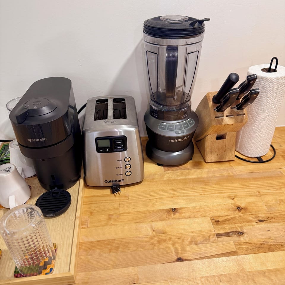 Toaster, blender and butcher block with knives