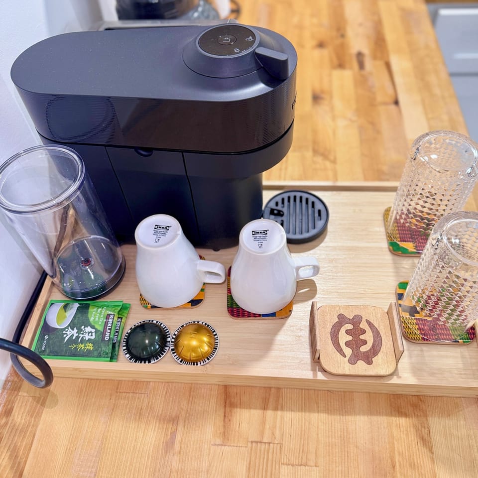 Nespresso Coffee maker and with complimentary coffee and tea. 