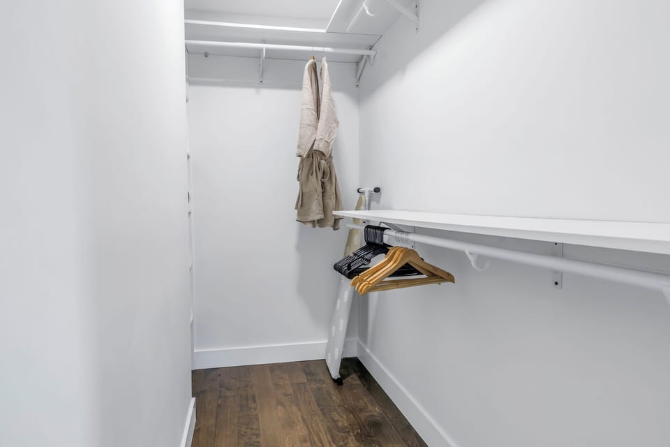 Master bedroom with walk in closet and en-suite bathroom