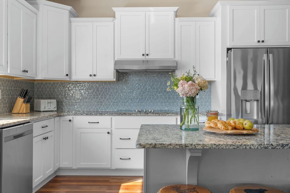 - Bright kitchen ready for your favorite recipes, cozy breakfasts, & midnight snacks
- Fresh flowers on the counter & morning light through the window create a space that feels like home
- Whether cooking or chatting, this spot is full of good vibes