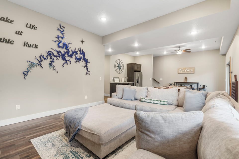 Downstairs Recreation Room Features a Kitchenette, Additional Dining Space, a Lovely Seating Area with Cable TV and a Fireplace, Pool Table, a Multi-Game Arcade Machine, and Access to the Lower Deck!