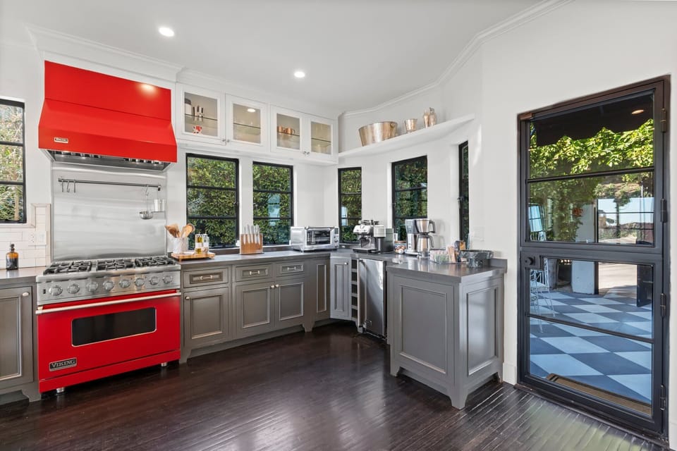 A fully stocked kitchen with high-end Viking appliances and sleek custom cabinetry.