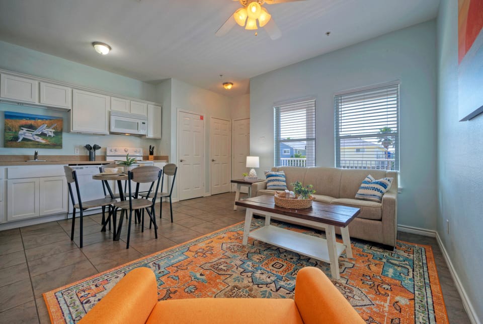 Bright and airy living room featuring a cozy sleeper sofa for extra guests.