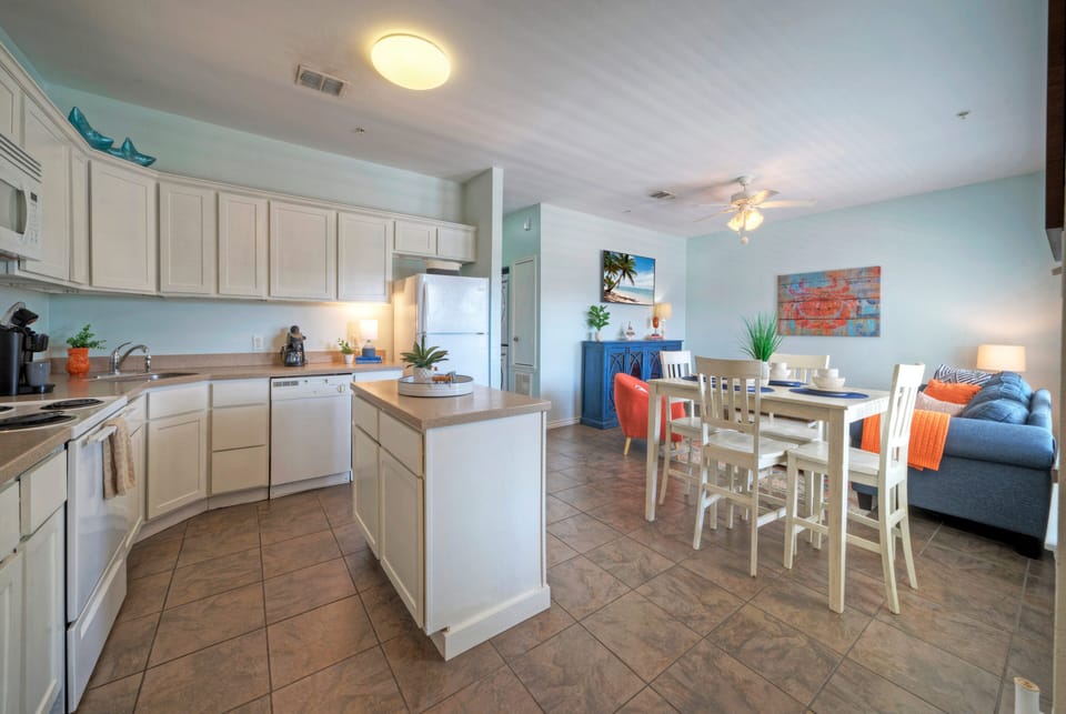 Cozy kitchen area with a small kitchen island, perfect for meal prep and casual dining.