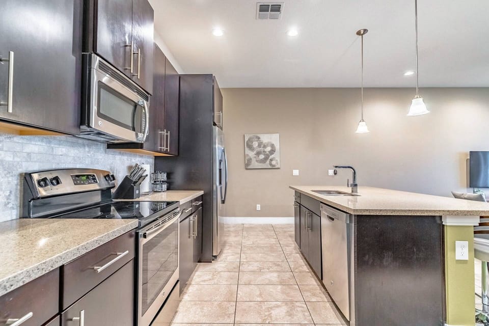 Updated kitchen with granite counters and stainless steel appliances