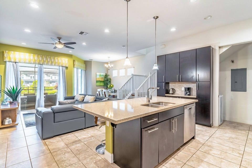Bright and open floor plan gives you access to the kitchen, dining, living room, laundry room and the home's private pool!