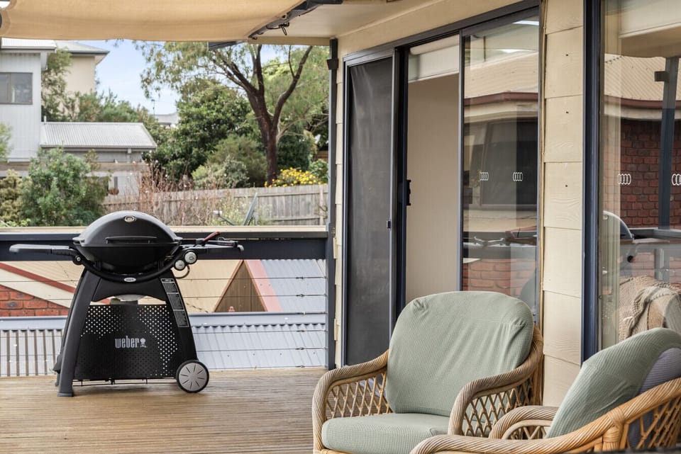 Bay facing deck with outdoor dining and gas BBQ