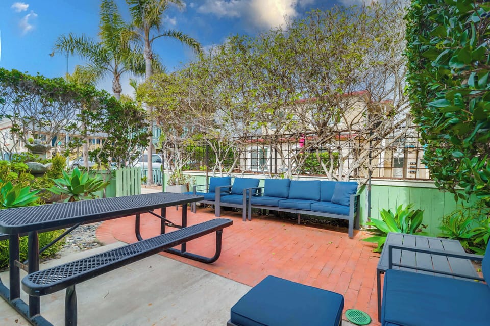 Brick patio and some privacy from the foliage