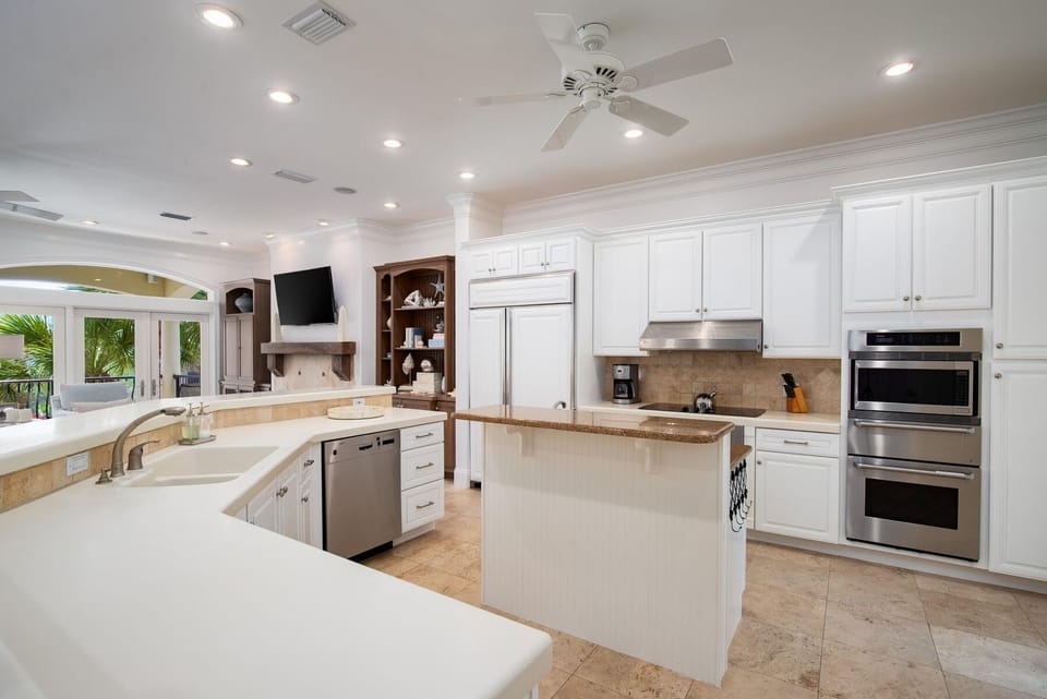 Your gourmet kitchen awaits with gleaming granite counters, top-tier stainless appliances, and an island perfect for morning coffee or evening meal prep.
