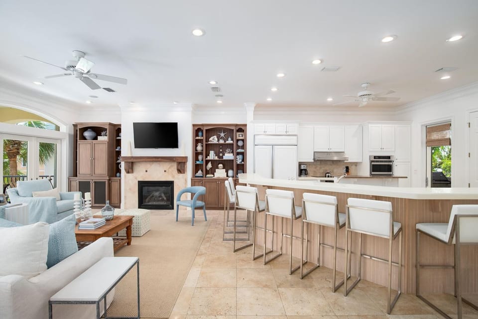 Your elegant open-concept space seamlessly blends living and dining, featuring a modern kitchen island perfect for morning coffee and evening gatherings.