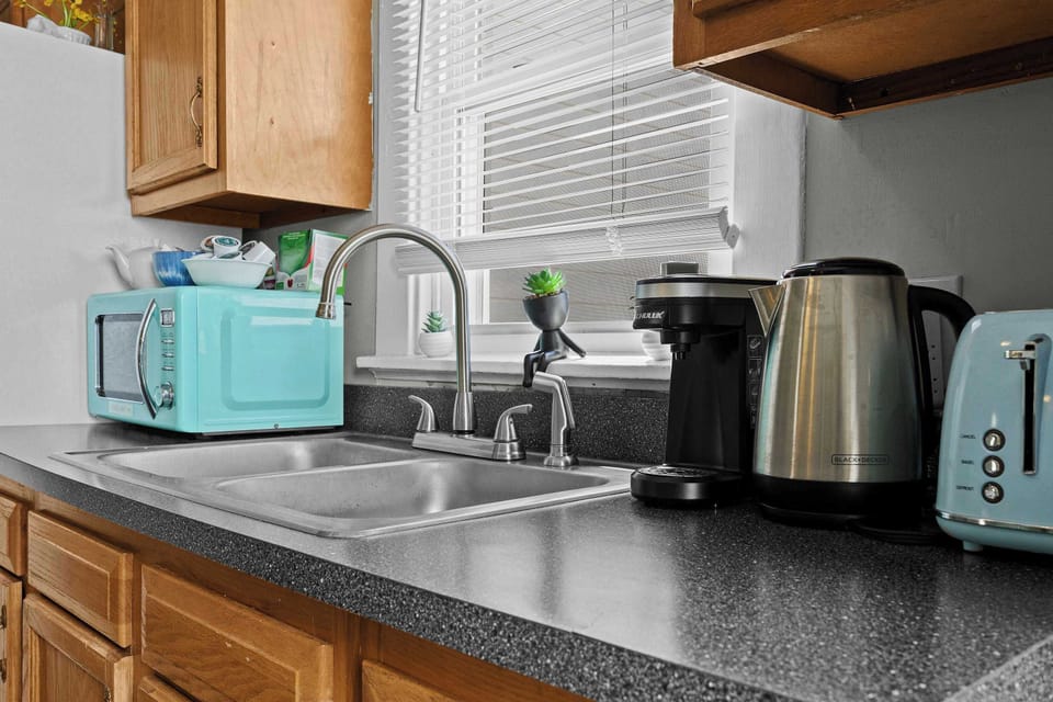 Kitchen: This home features a spacious kitchen- perfect for creating home-cooked meals!
