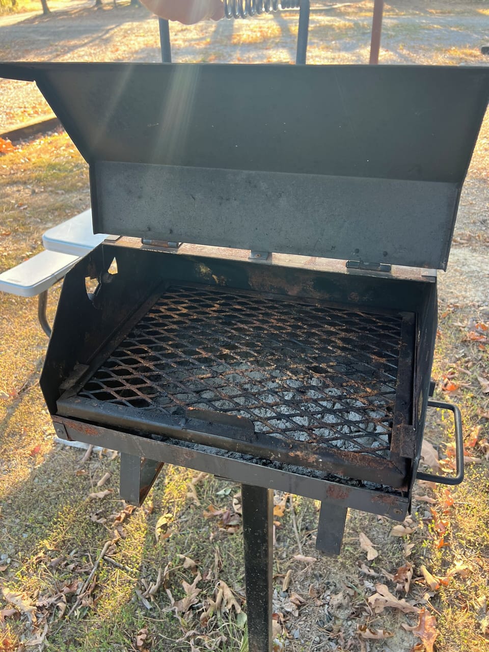 Outdoor charcoal grill with picnic table