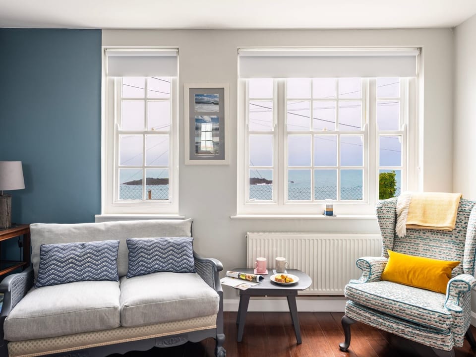 Bright and sunny sitting room with sea views 
