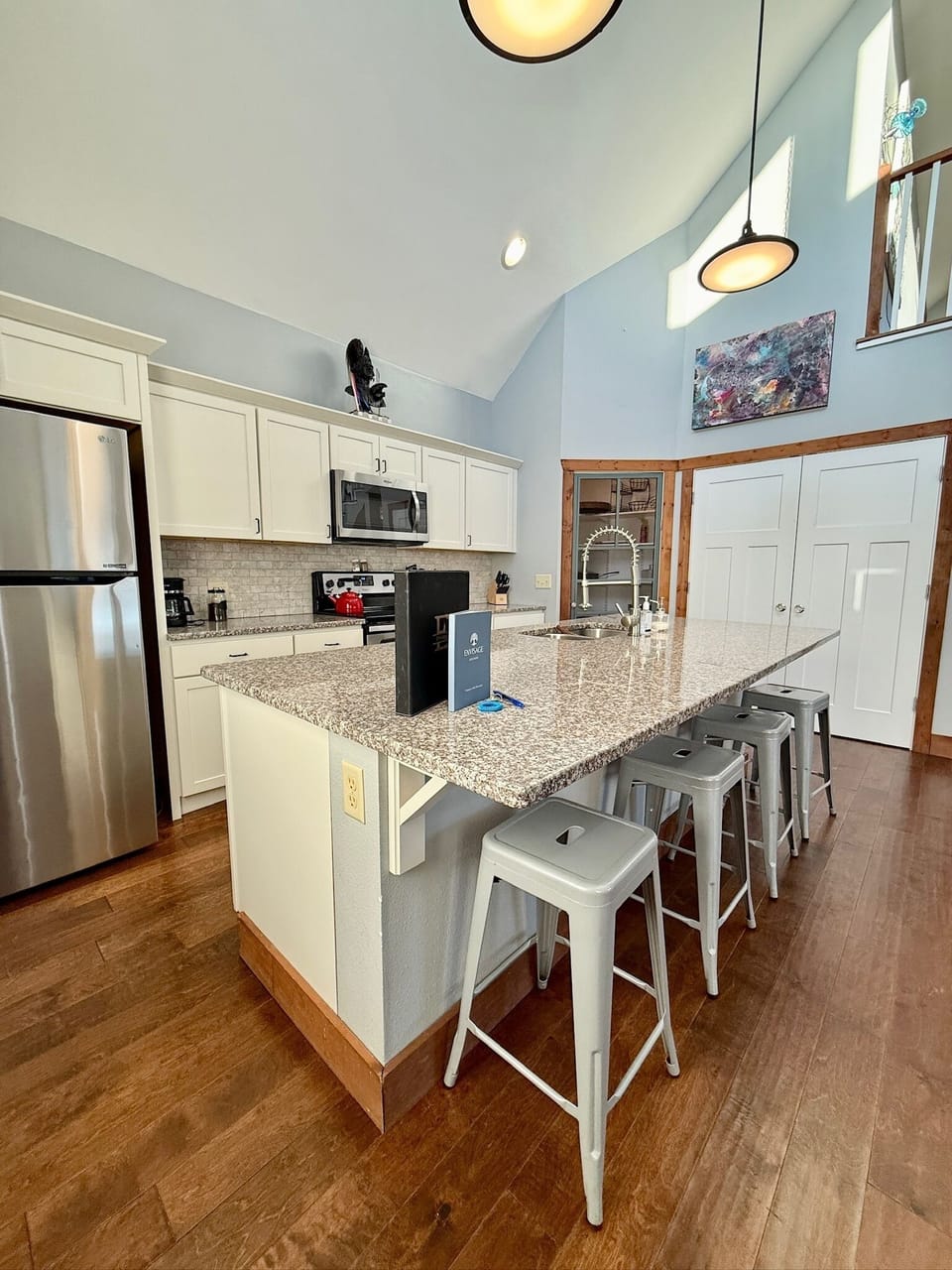 Envisage great room: Kitchen island and closet to laundry depicted.