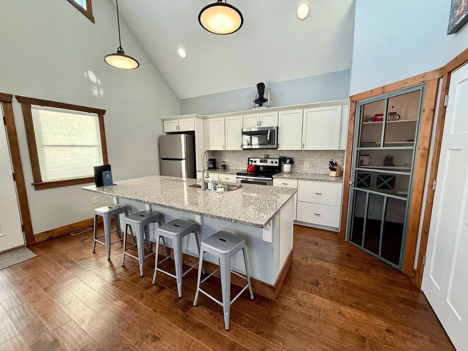 Envisage great room: Kitchen island and pantry depicted.