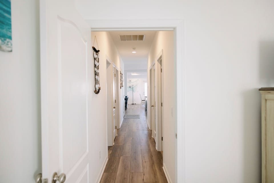hallway view from primary bedroom to living area