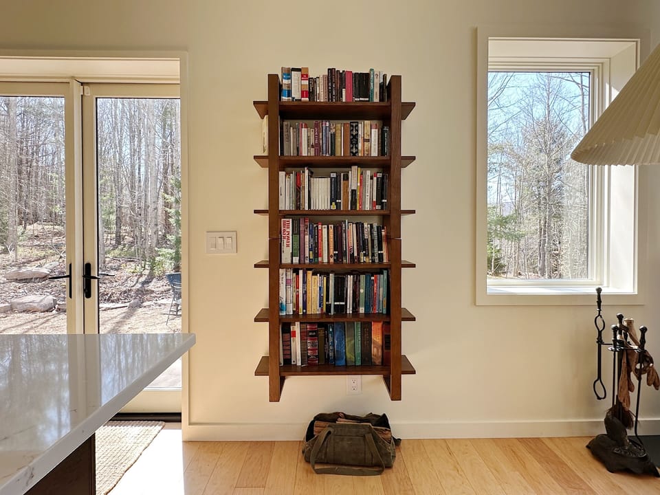 bookshelf full of different type of books